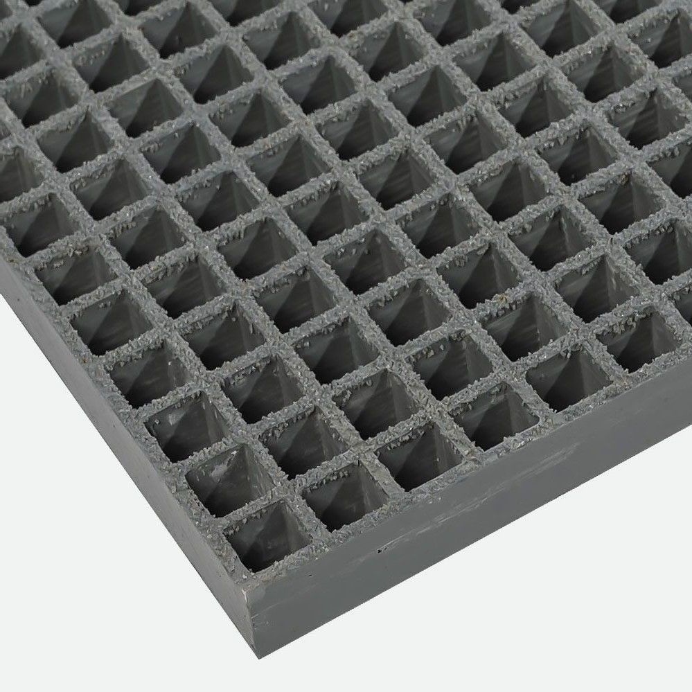 Close-up of dark grey gritted GRP grating
