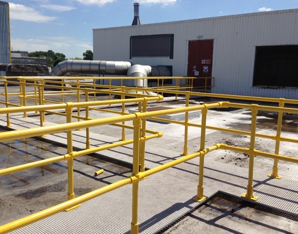 Yellow GRP handrail system on an industrial platform