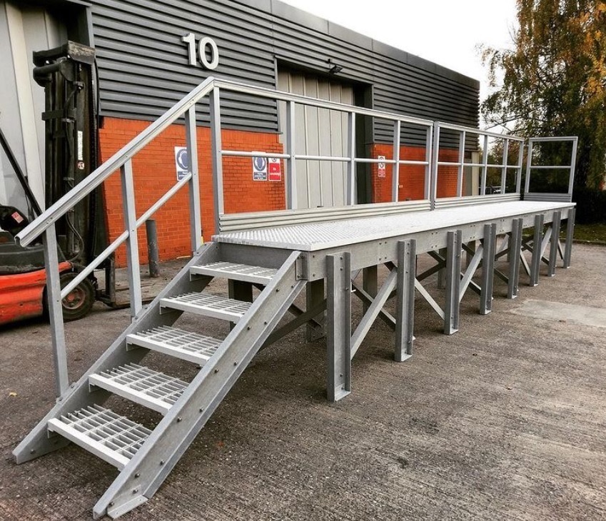 GRP loading platform with stairs and handrails