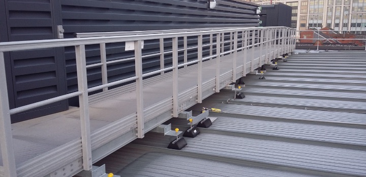 GRP rooftop walkway with continuous handrail