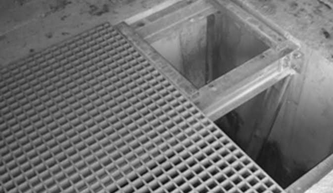 GRP grating panels covering an open service riser